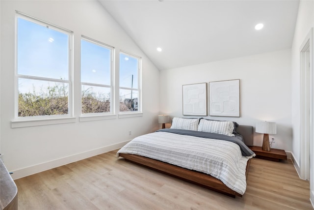 bedroom featuring recessed lighting, wood finished floors, baseboards, and vaulted ceiling