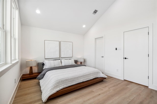 bedroom with recessed lighting, light wood-style floors, visible vents, and baseboards