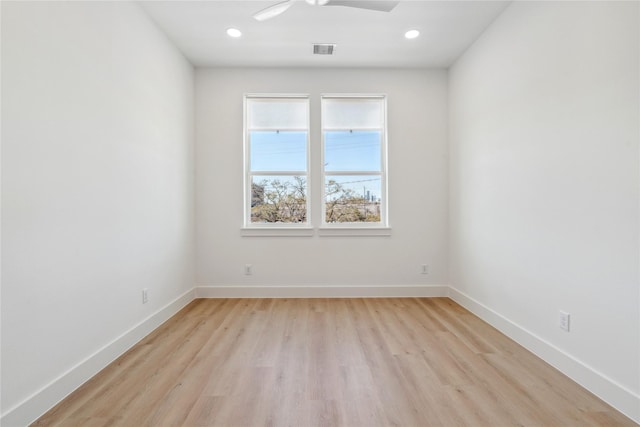 spare room featuring recessed lighting, visible vents, light wood-style flooring, and baseboards