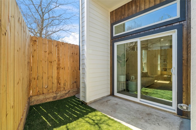 doorway to property featuring fence