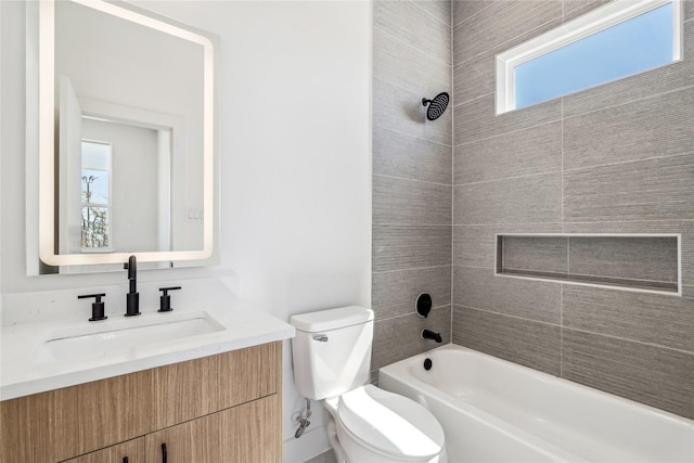 bathroom with shower / bath combination, toilet, and vanity