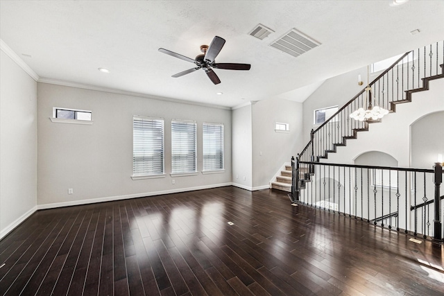 unfurnished living room with visible vents, ornamental molding, wood finished floors, baseboards, and ceiling fan