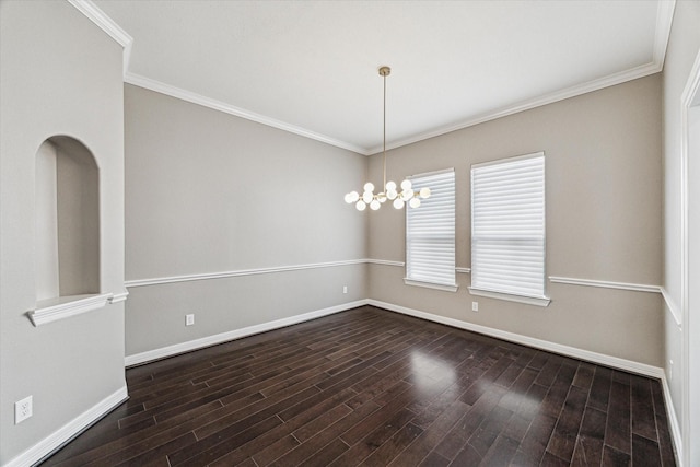 spare room with crown molding, baseboards, and dark wood-style flooring