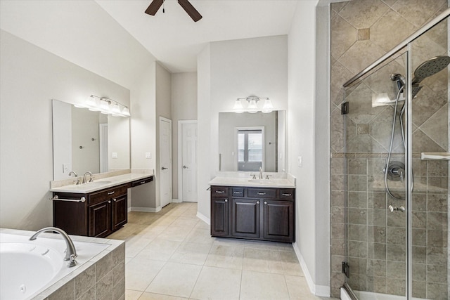 full bath featuring a shower stall, a garden tub, a ceiling fan, and a sink