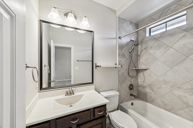 bathroom with toilet, vanity, and bathtub / shower combination