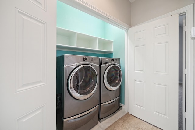 laundry area featuring separate washer and dryer and laundry area