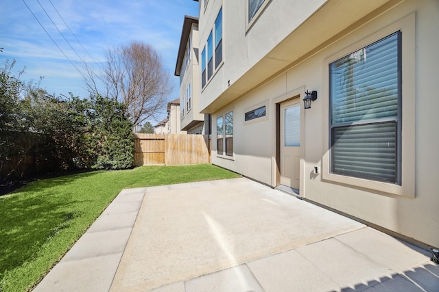 view of patio / terrace featuring fence