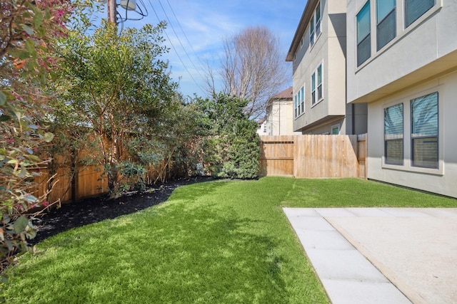 view of yard with a fenced backyard