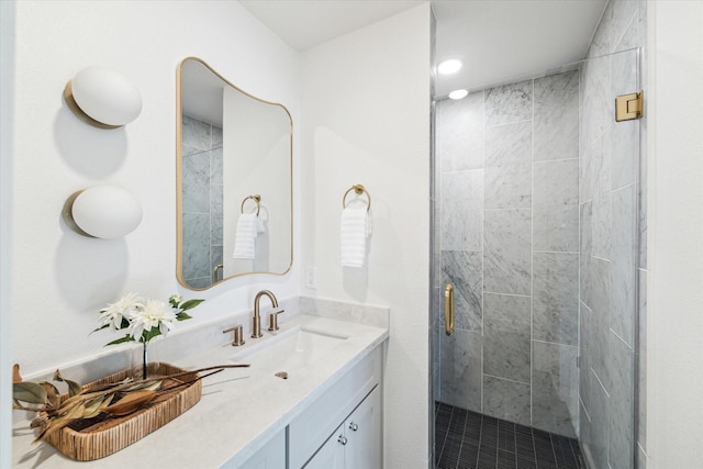 bathroom featuring vanity and a shower stall