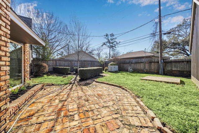 view of yard with a patio and a fenced backyard