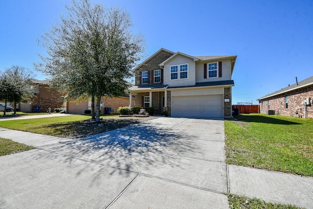 traditional home featuring a garage, driveway, a front lawn, and fence