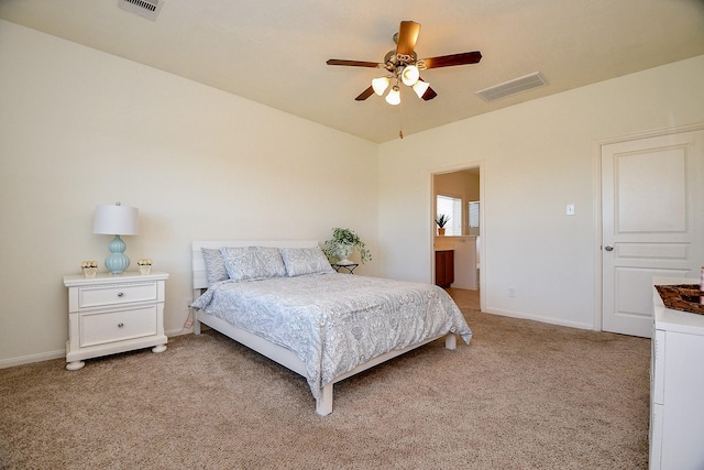 bedroom featuring a ceiling fan, baseboards, visible vents, and light carpet