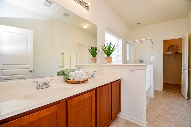 full bath with a shower with door, visible vents, and a sink