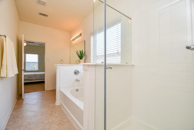 ensuite bathroom featuring a bath, visible vents, a tile shower, and ensuite bath