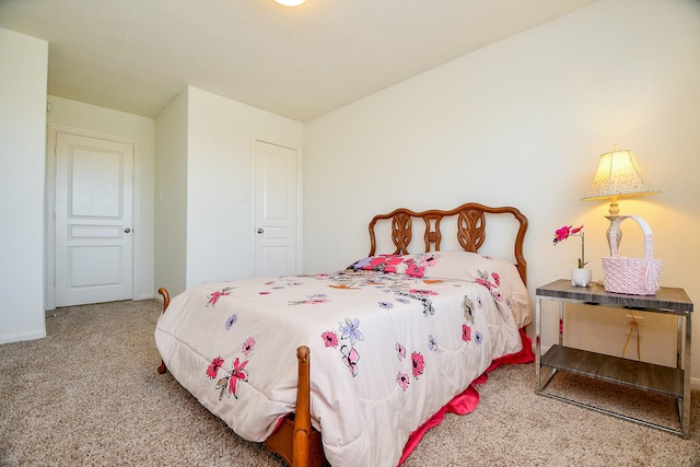 carpeted bedroom with baseboards