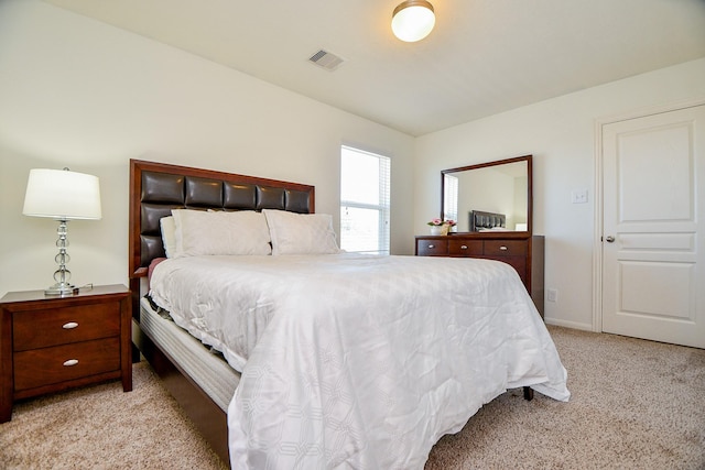 bedroom with carpet flooring, baseboards, and visible vents