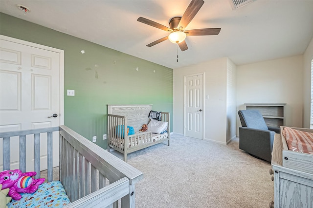 bedroom featuring a ceiling fan, carpet flooring, baseboards, and visible vents