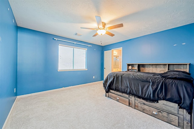 bedroom featuring visible vents, baseboards, carpet flooring, a textured ceiling, and a ceiling fan