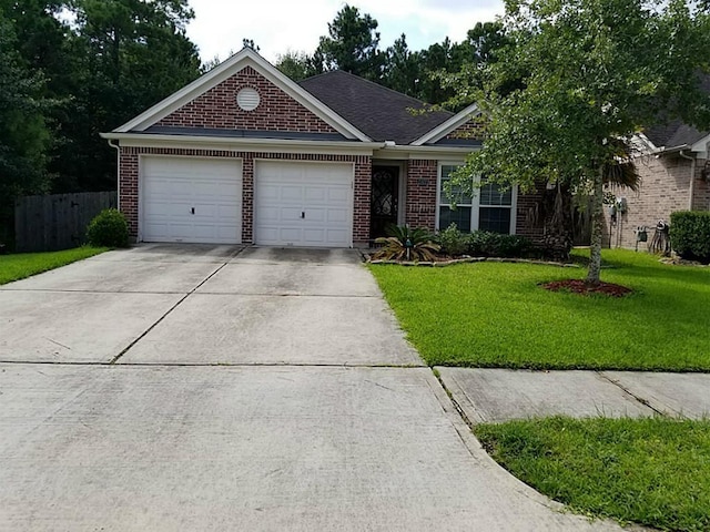 single story home featuring brick siding, an attached garage, a front lawn, fence, and driveway