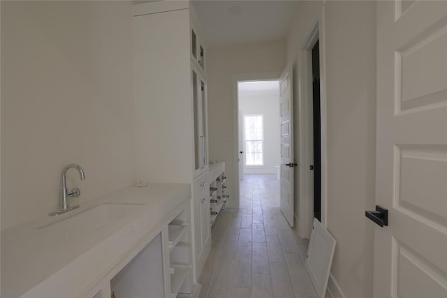 bathroom with vanity and wood finished floors