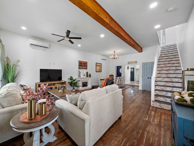 living room featuring beamed ceiling, dark wood finished floors, a wall unit AC, recessed lighting, and stairway