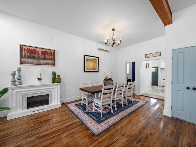 dining space featuring beamed ceiling, a notable chandelier, an AC wall unit, dark wood-style floors, and baseboards