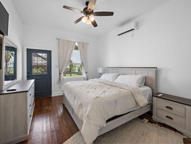 bedroom featuring a wall unit AC, dark wood-style flooring, and ceiling fan