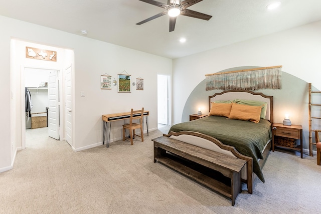 bedroom featuring carpet floors, recessed lighting, baseboards, ceiling fan, and a walk in closet