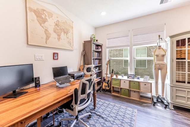 office space with dark wood-style flooring