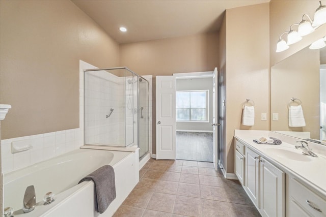 full bathroom with vanity, baseboards, a shower stall, tile patterned floors, and a bath