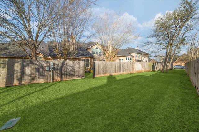 view of yard featuring a fenced backyard