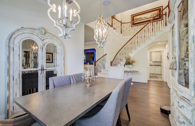 dining area with ornamental molding, wood finished floors, stairway, arched walkways, and french doors