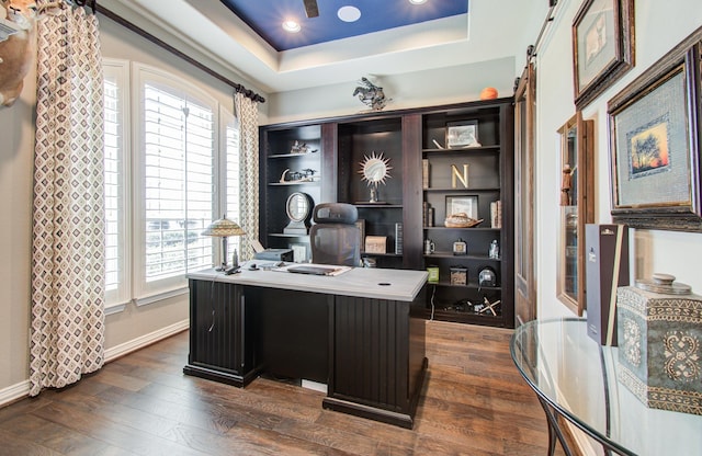 office area with recessed lighting, baseboards, a raised ceiling, and dark wood-style floors