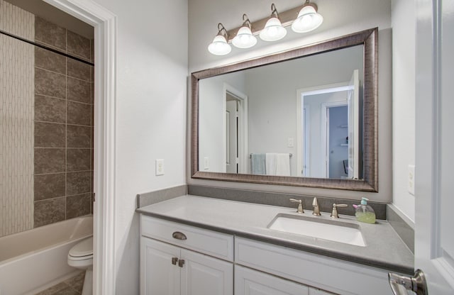 full bathroom with vanity, bathing tub / shower combination, and toilet