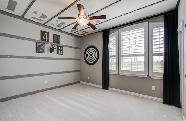 empty room featuring baseboards, carpet, and ceiling fan