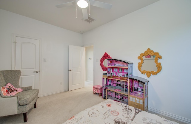 recreation room featuring visible vents, baseboards, carpet, and a ceiling fan