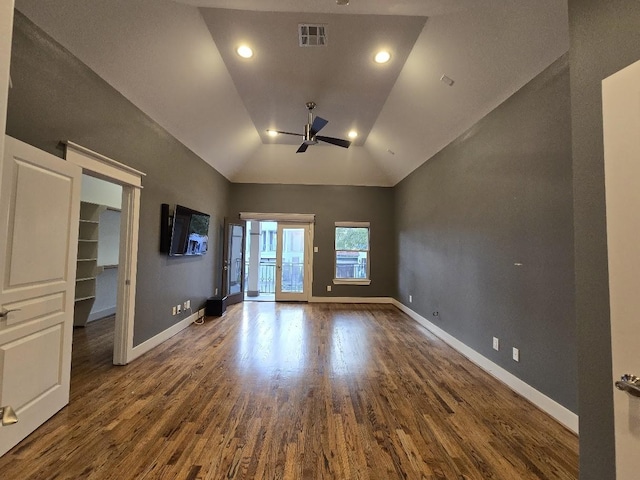 interior space with visible vents, baseboards, wood finished floors, and a ceiling fan