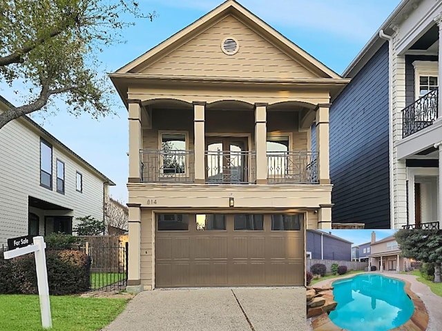 view of front of home with concrete driveway, a balcony, fence, and a garage