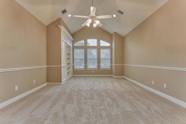 empty room featuring visible vents, built in shelves, baseboards, and a ceiling fan