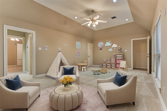 living room with baseboards, lofted ceiling, recessed lighting, ceiling fan, and light colored carpet