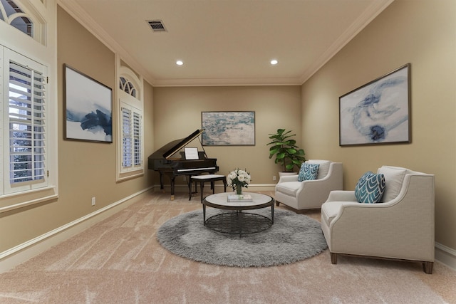 sitting room featuring baseboards, carpet floors, and ornamental molding