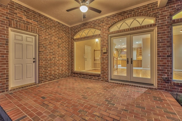 view of patio with french doors and a ceiling fan