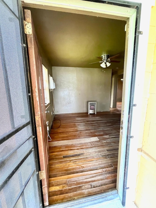 doorway to property featuring heating unit