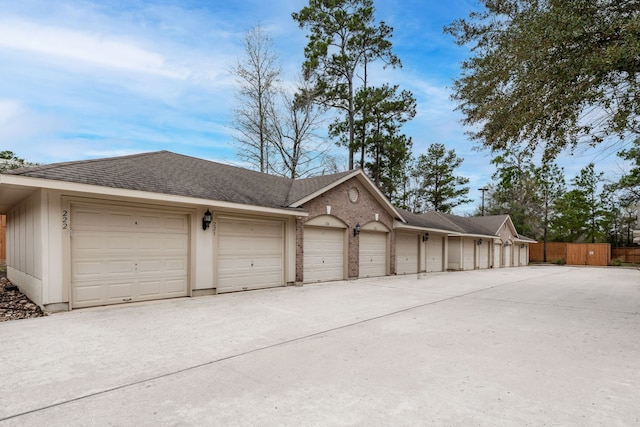 garage with fence