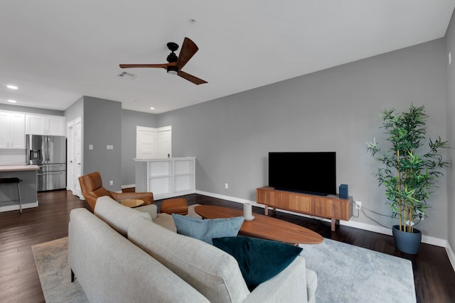 living area with visible vents, baseboards, recessed lighting, a ceiling fan, and dark wood-style flooring