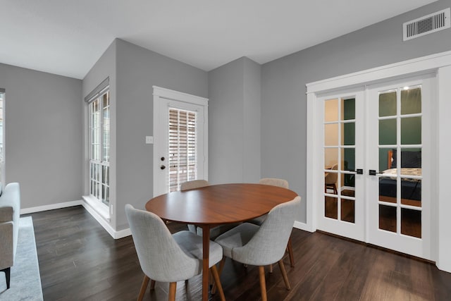 dining room with dark wood-style floors, french doors, and visible vents