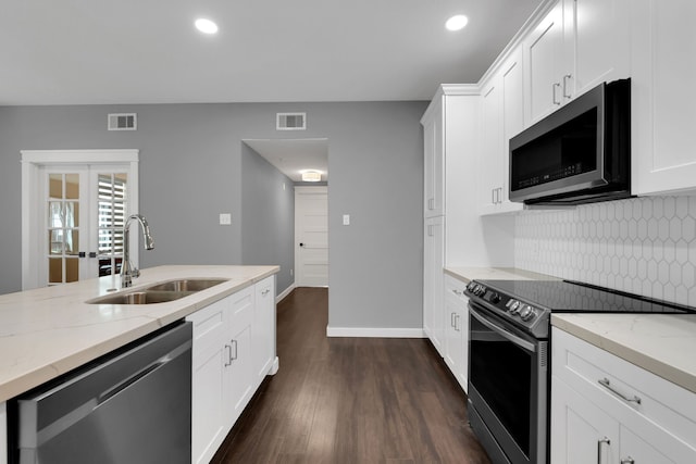 kitchen featuring dark wood-style flooring, visible vents, appliances with stainless steel finishes, and a sink