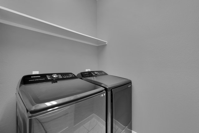 laundry room featuring independent washer and dryer and laundry area