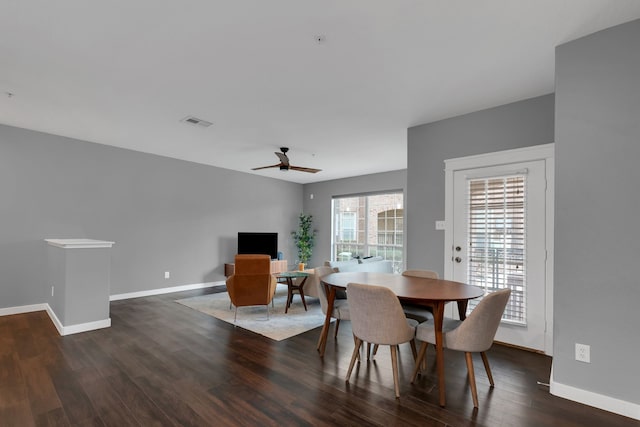 dining space featuring a ceiling fan, wood finished floors, visible vents, and baseboards