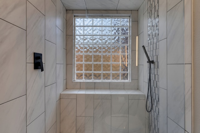 bathroom featuring tiled shower